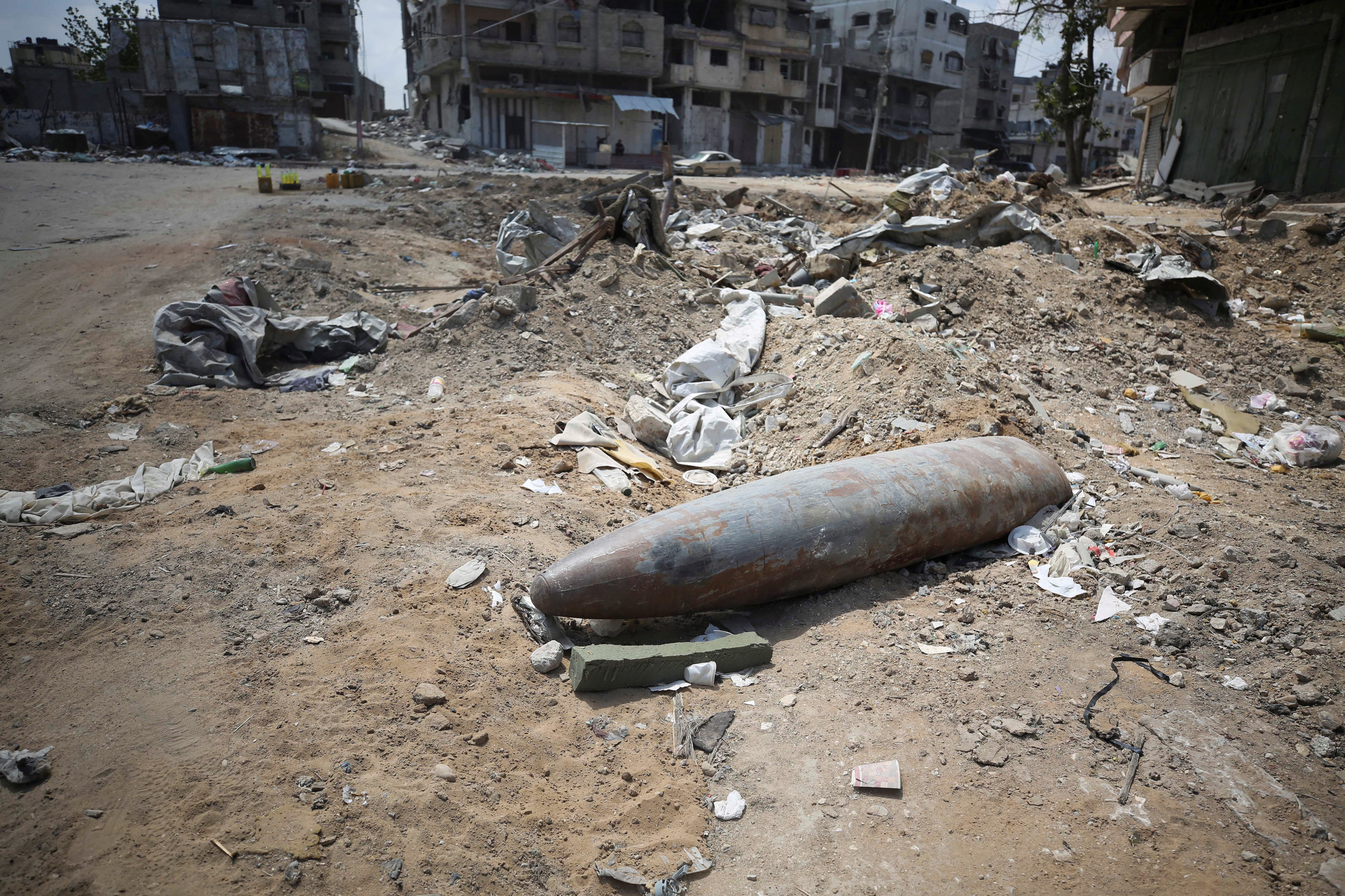 An unexploded missile fired by an Israeli aircraft lies among the rubble, in the northern Gaza Strip