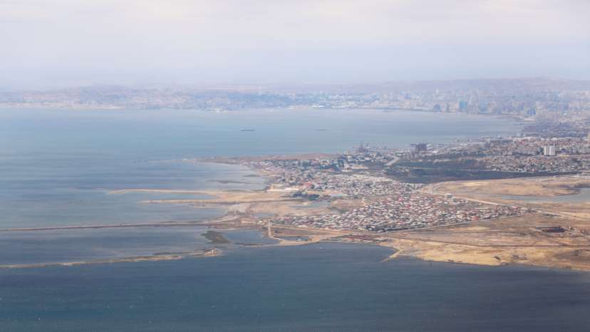 FILE PHOTO: An aerial view of the Caspian Sea near the city of Baku is pictured through the window of Turkish Airlines airplane, ahead of Europa League Final, in Baku