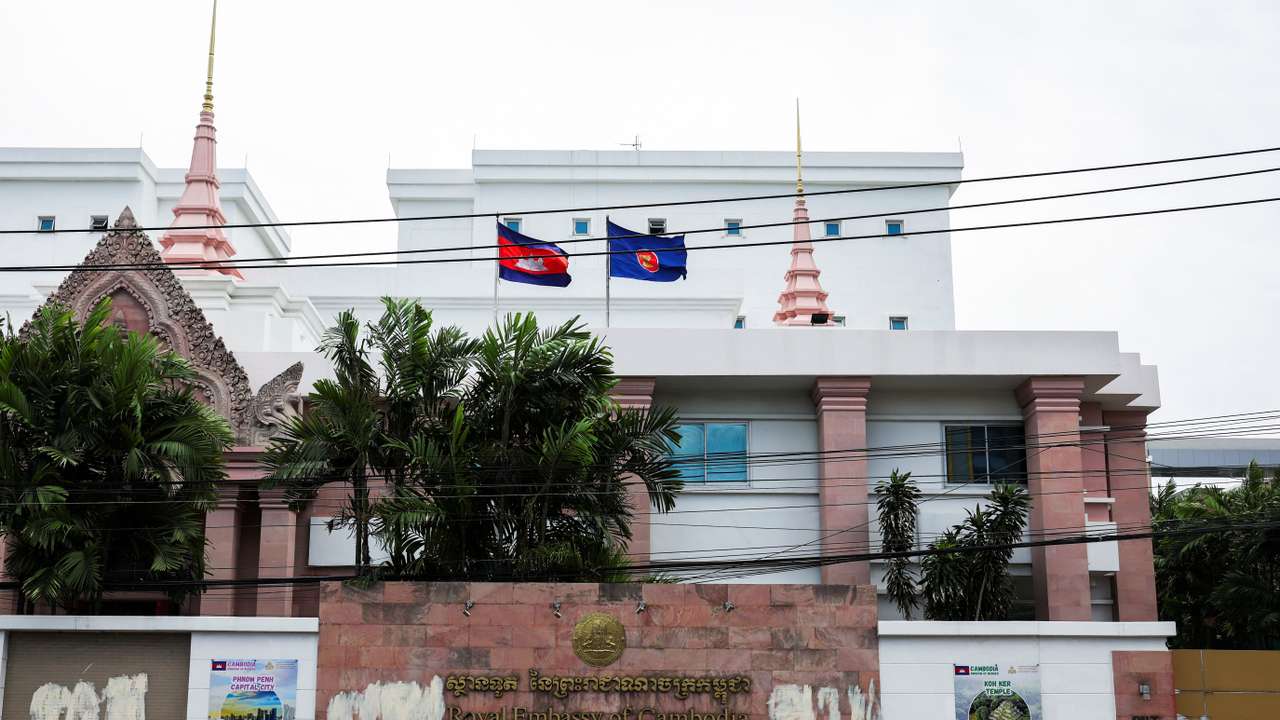 A woman walks past the Royal Embassy of Cambodia, after Thailand has recalled its ambassador to Cambodia an expelled Cambodia's ambassador, amid border disputes in Bangkok