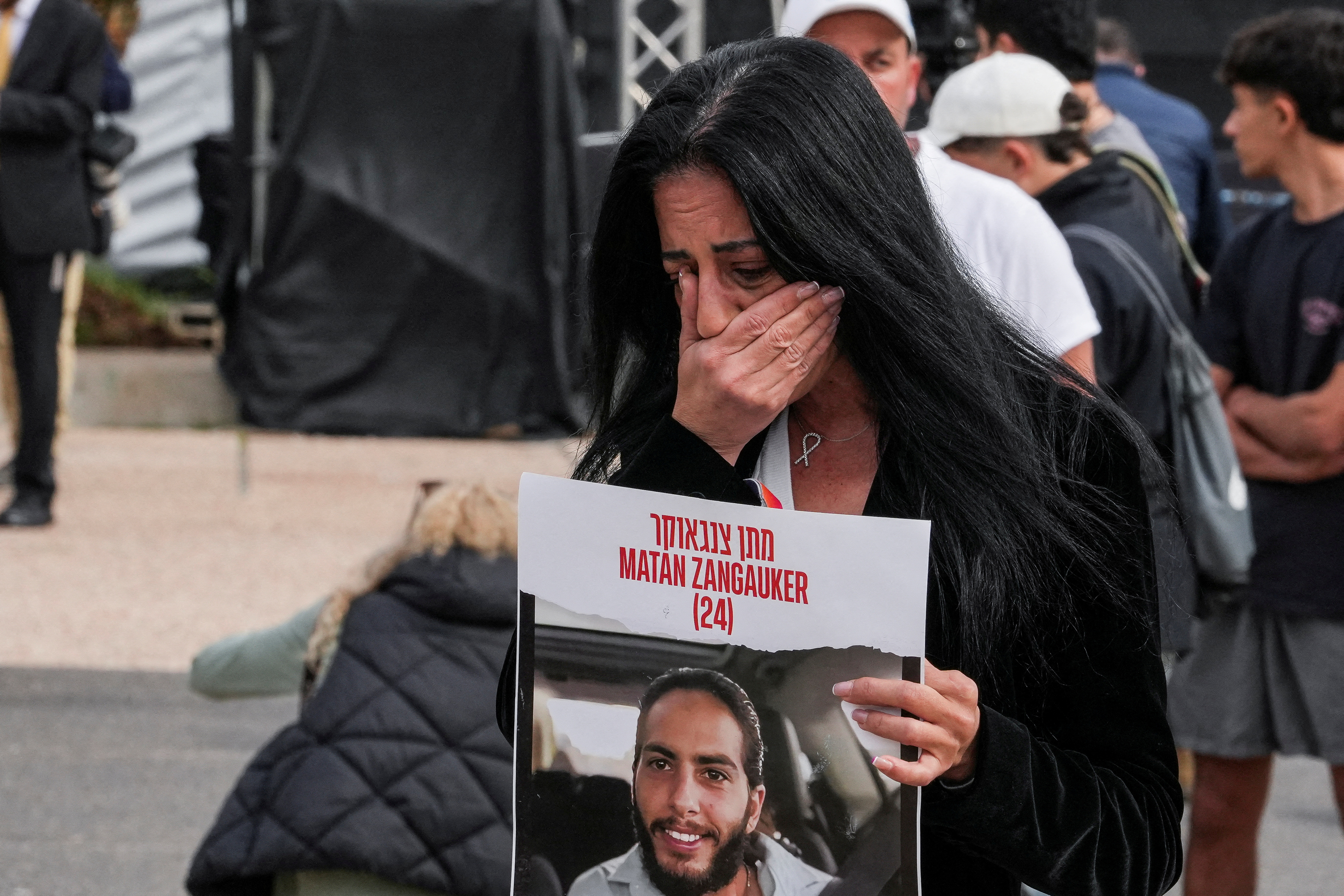 Family members and supporters of hostages deliver statements for the release of hostages who were kidnapped during the deadly October 7, 2023 attack by Hamas, in Tel Aviv