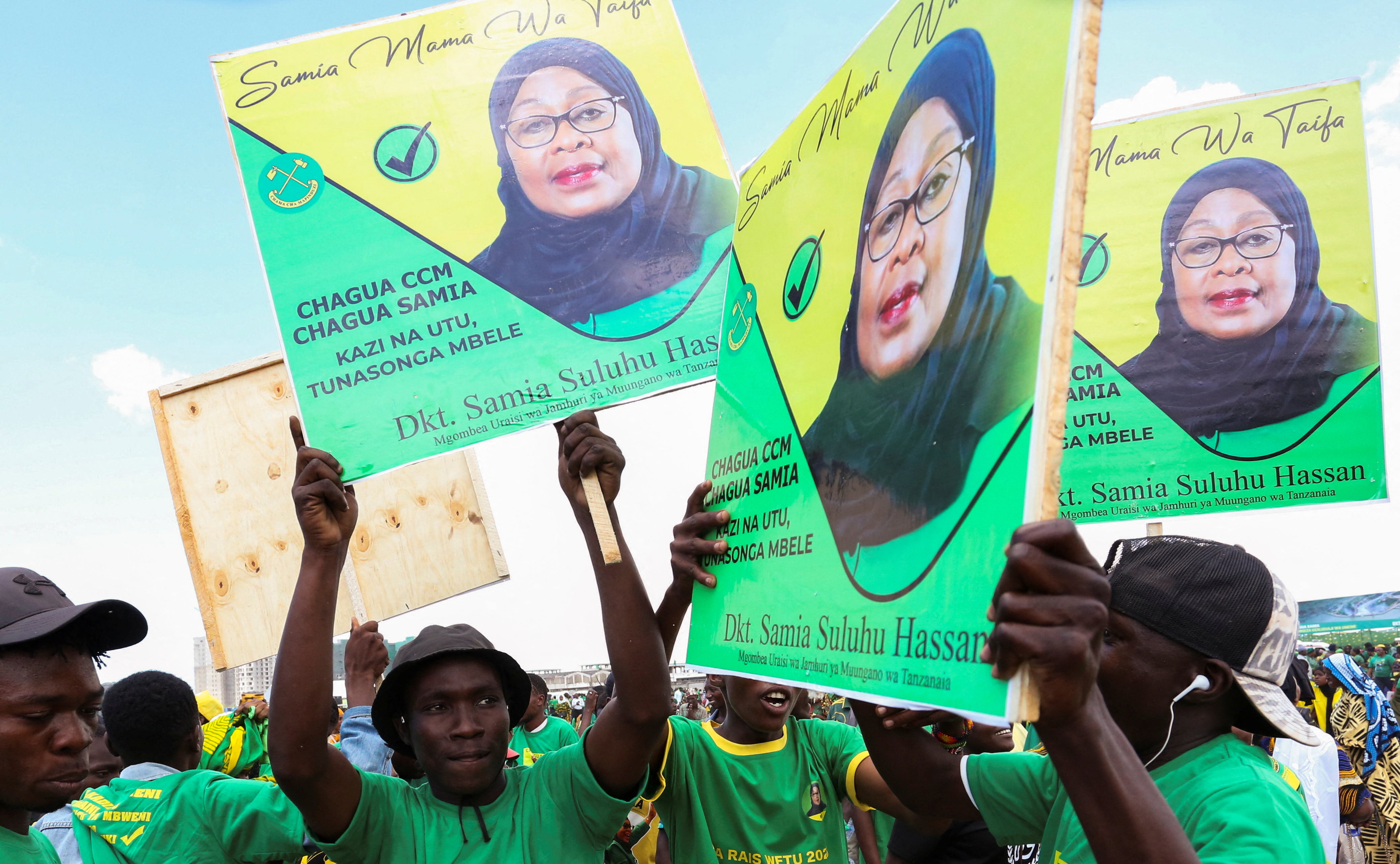 Supporters of Tanzania's President Samia Suluhu Hassan of the ruling CCM party attend a campaign rally in Dar Es Salaam