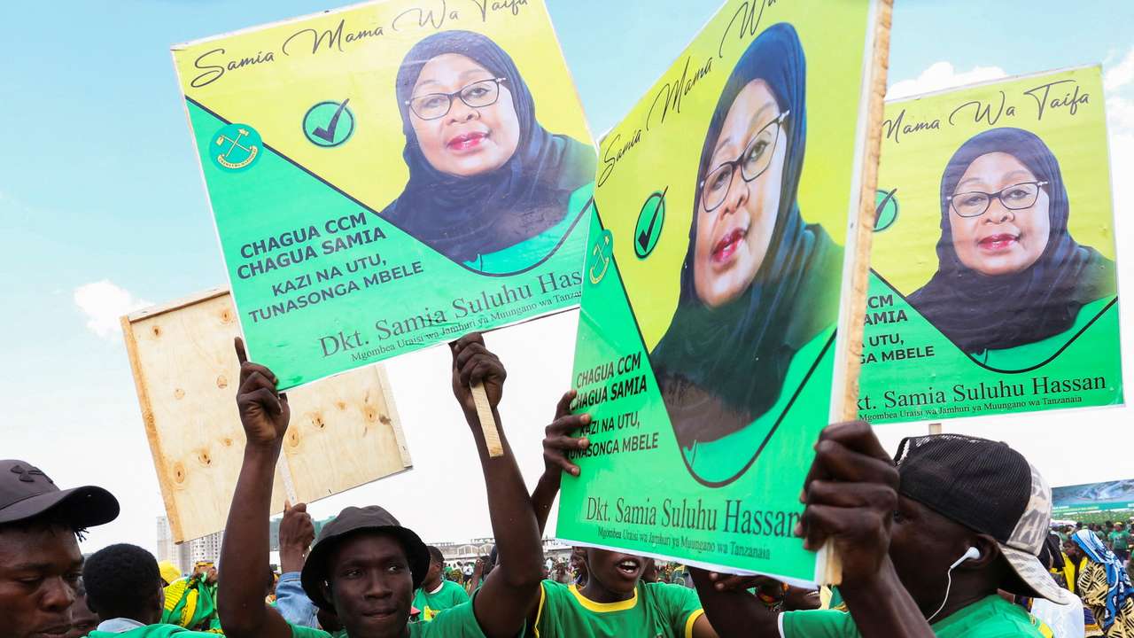 Supporters of Tanzania's President Samia Suluhu Hassan of the ruling CCM party attend a campaign rally in Dar Es Salaam