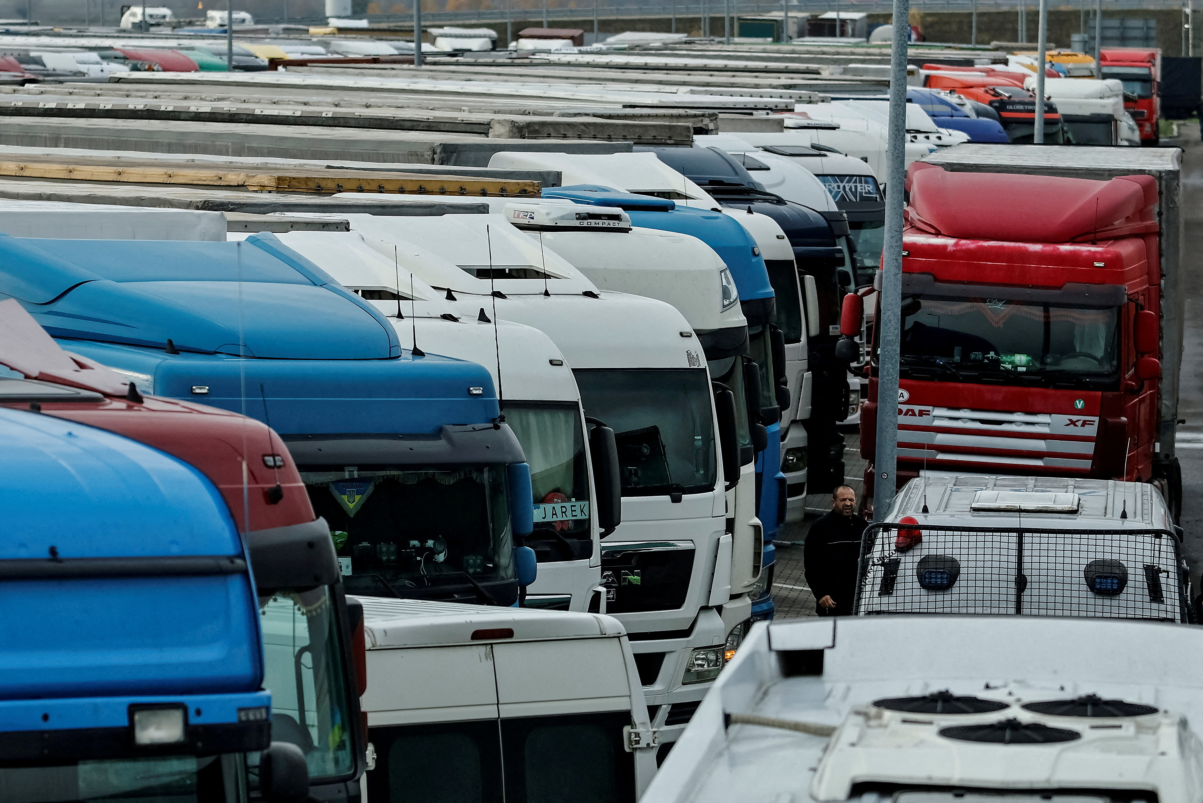 FILE PHOTO: FILE PHOTO: Ukrainian trucks are parked near the Poland-Ukraine border, near the village of Korczowa