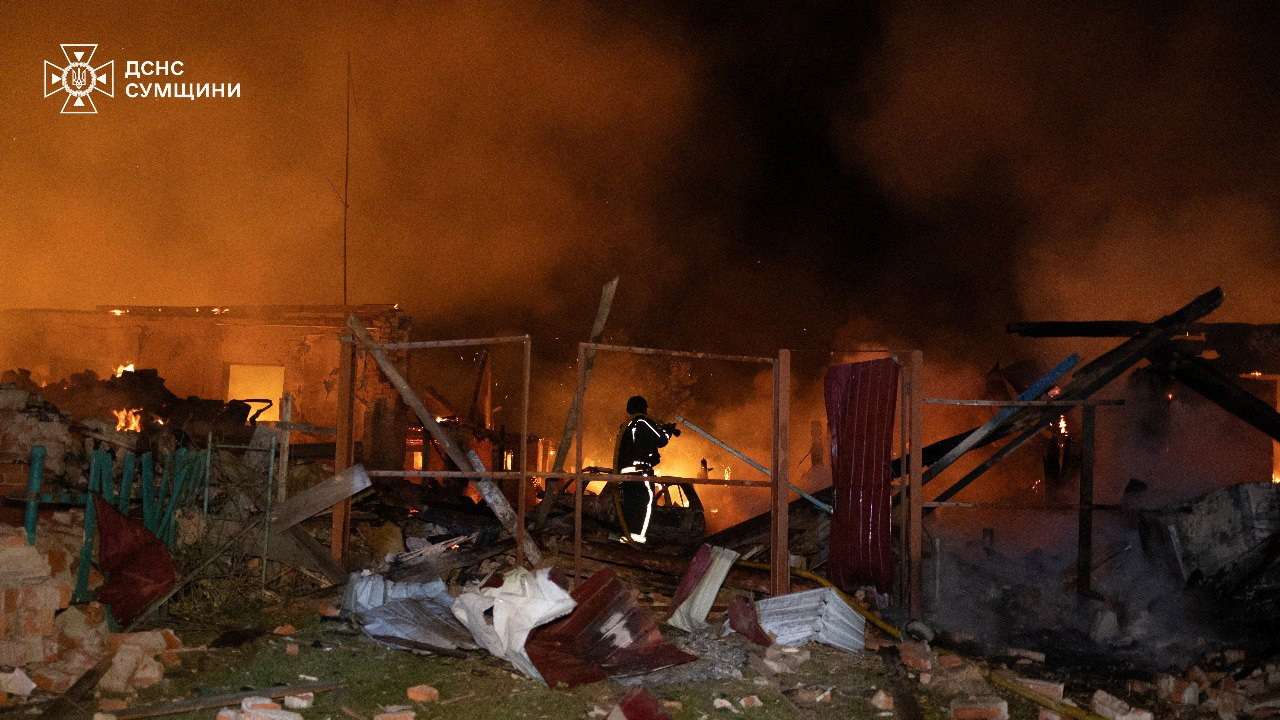 Emergency personnel work following a Russian drone attack at a location given as Sumy region