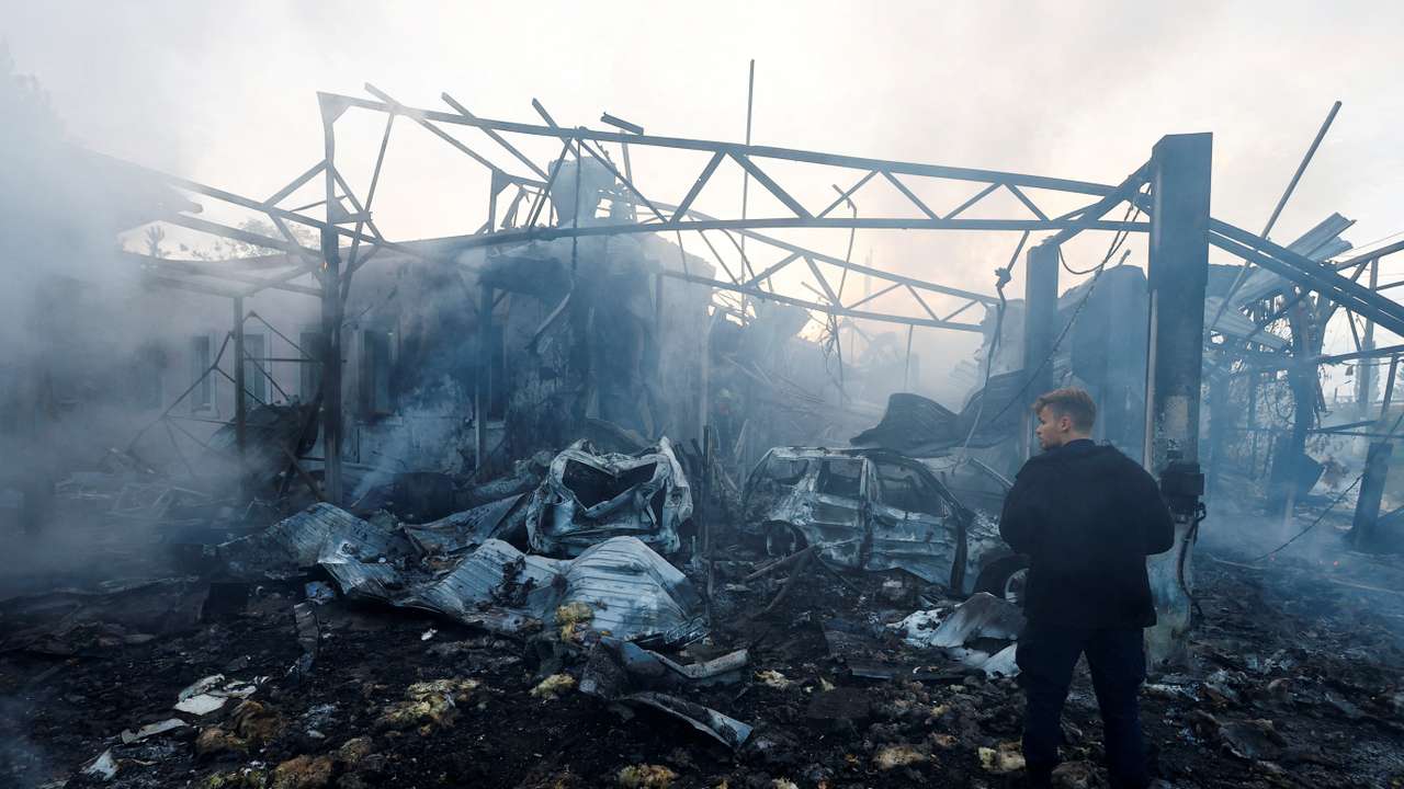Firefighters work at a site damaged during a Russian missile strike, in Kyiv