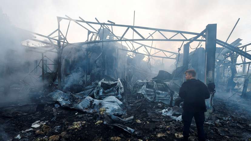 Firefighters work at a site damaged during a Russian missile strike, in Kyiv