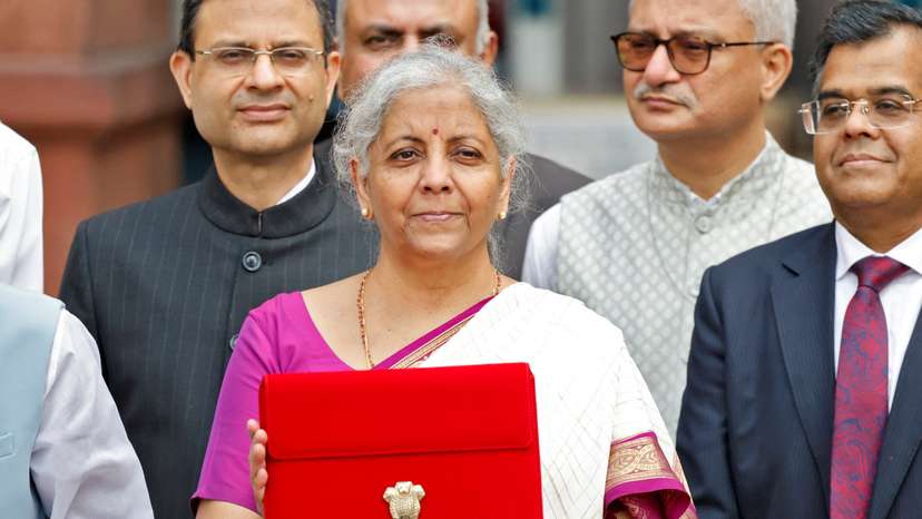 India's Finance Minister Nirmala Sitharaman holds up a folder with the Government of India's logo, in New Delhi