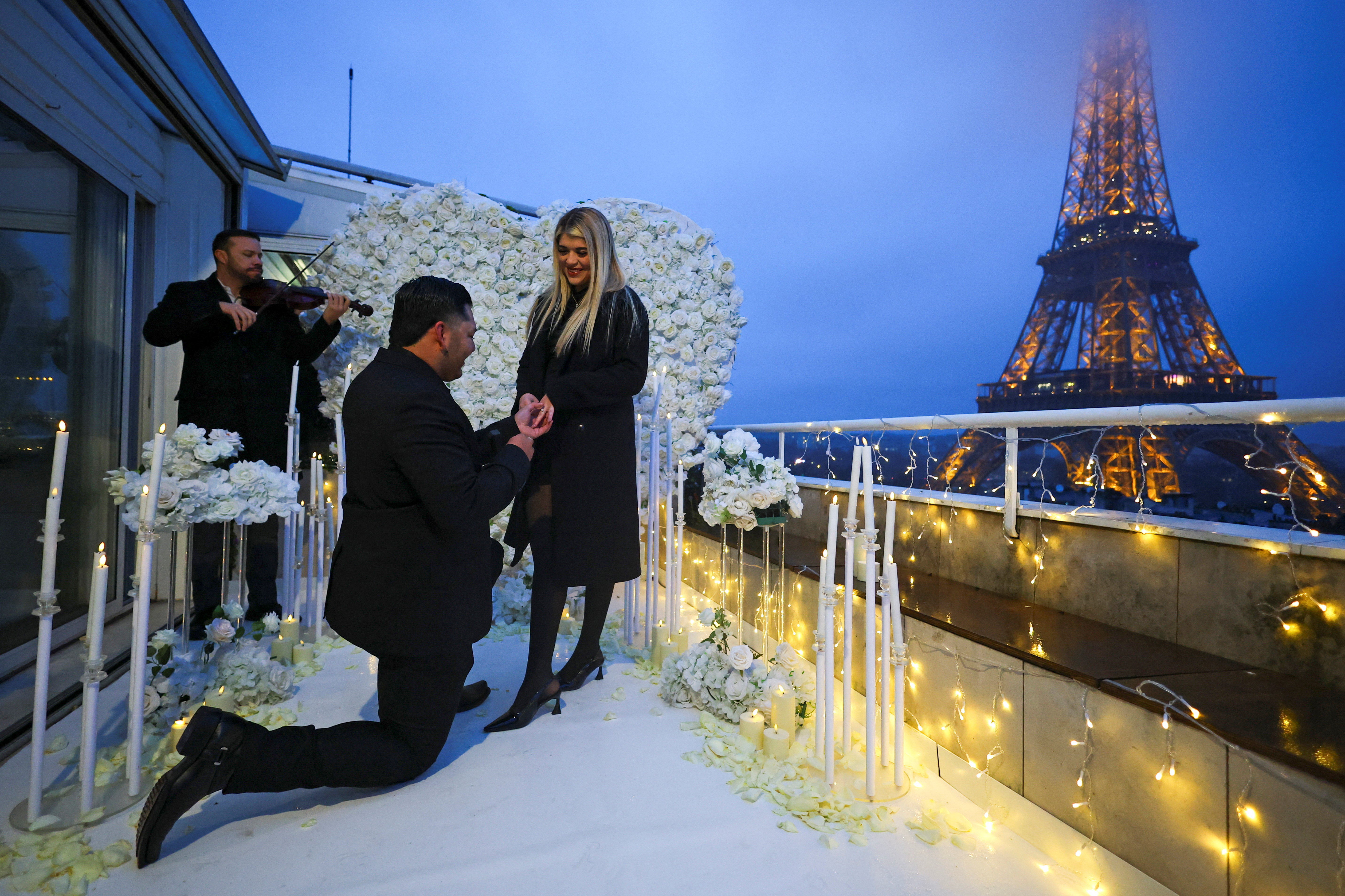 Marriage proposal organised by a specialised agency near the Eiffel Tower in Paris
