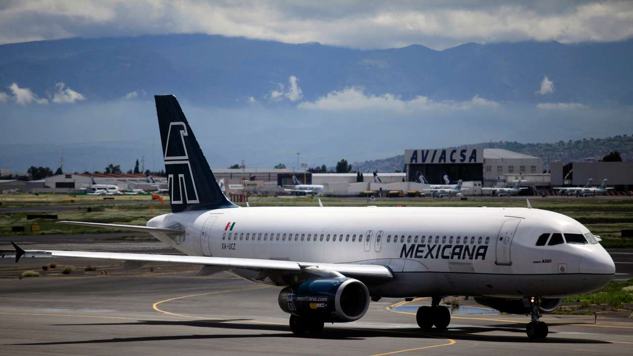 A Mexicana Airlines Airbus A320 passenger jet is seen at the Benito Juarez international airport in Mexico City