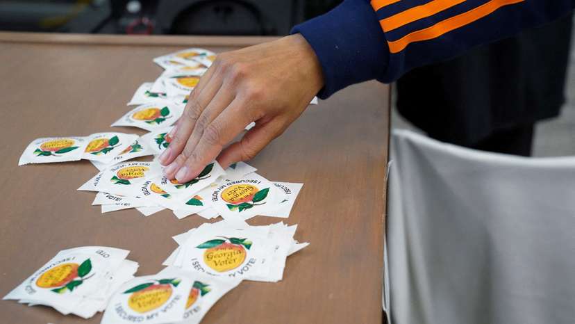 FILE PHOTO: Georgians turned out a day after the battleground state opened early voting