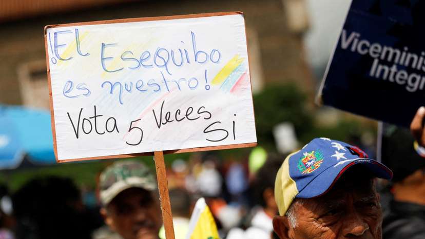 FILE PHOTO: People march in support of a referendum over disputed territory, in Caracas