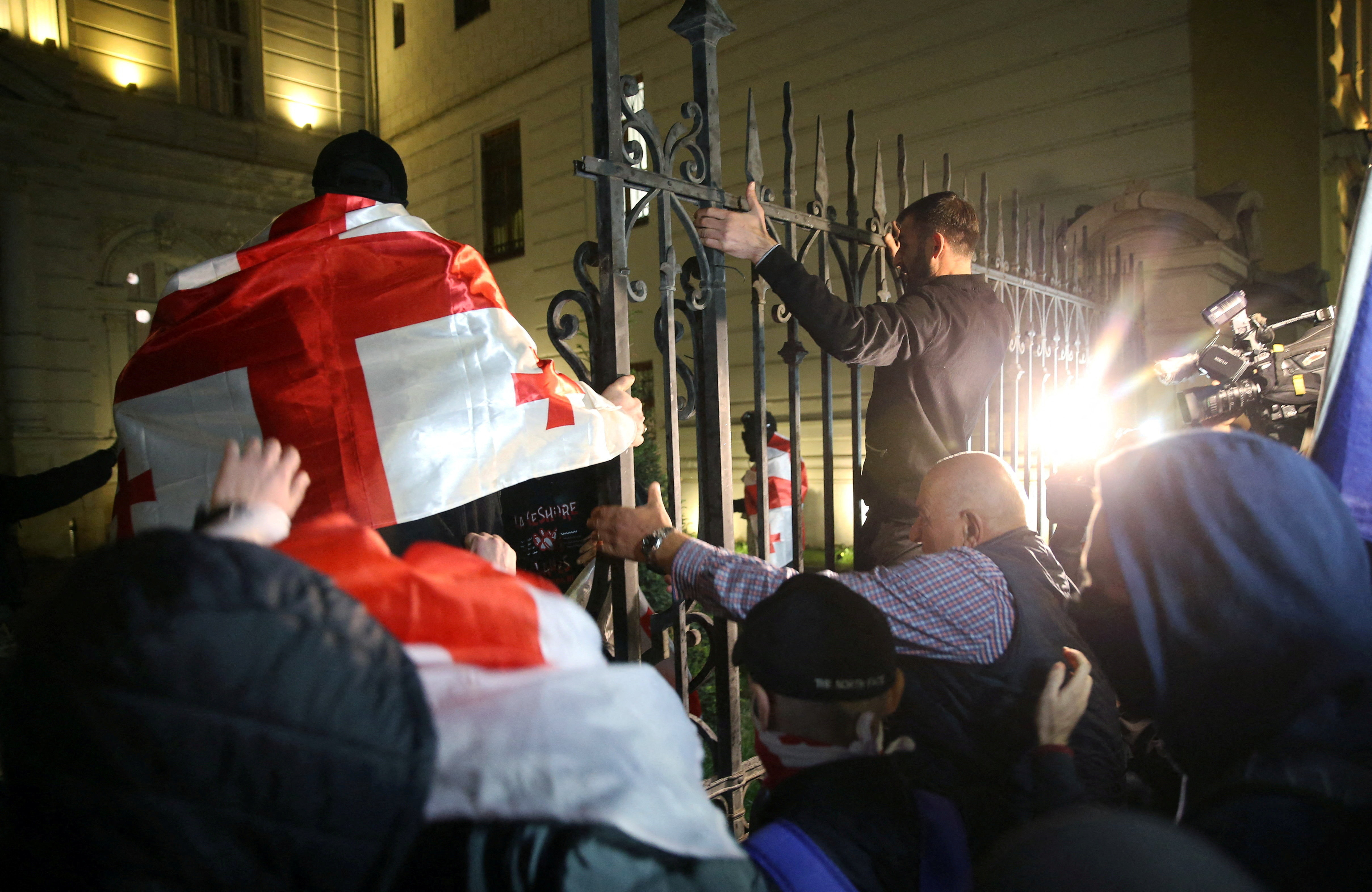 Opposition supporters hold a rally on the day of local elections in Tbilisi
