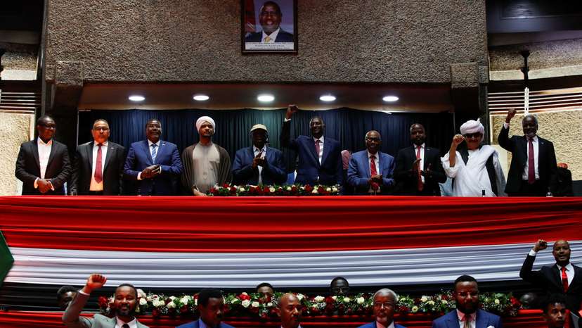 Delegates affiliated to Sudan's Rapid Support Forces (RSF) react during a meeting in Nairobi