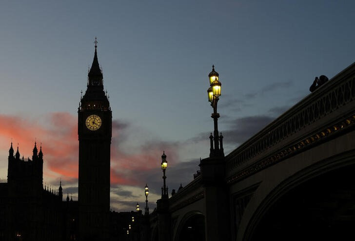 Houses of Parliament are seen at dusk in London