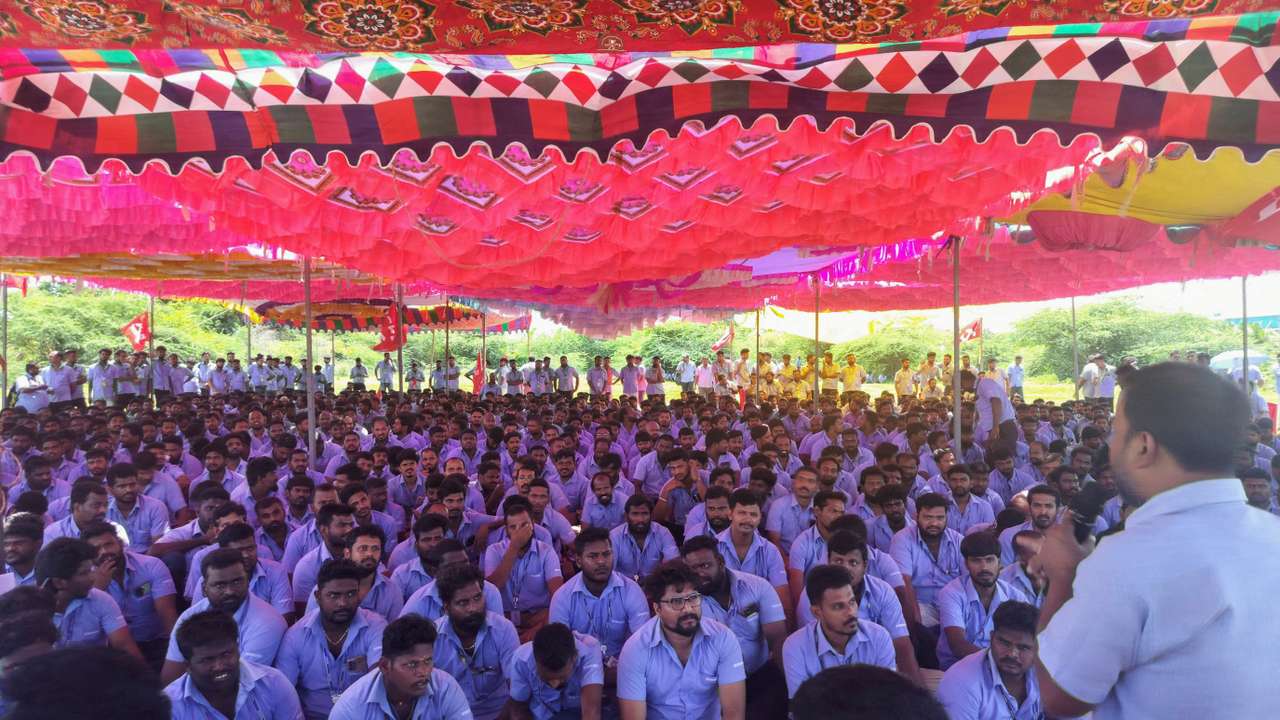 FILE PHOTO: Workers of a Samsung facility listen to a speaker during a strike to demand higher wages at its Sriperumbudur plant