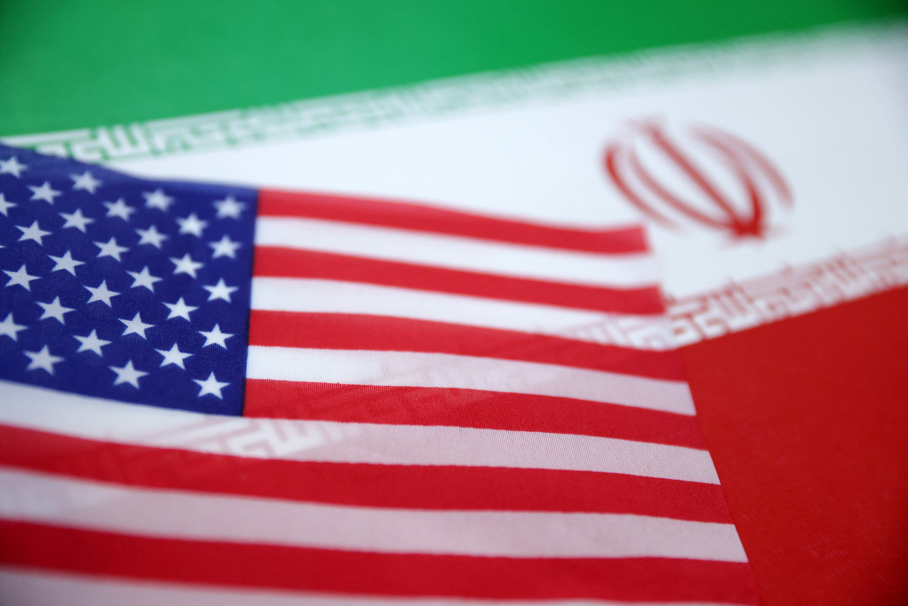 Illustration shows U.S. and Iran flags