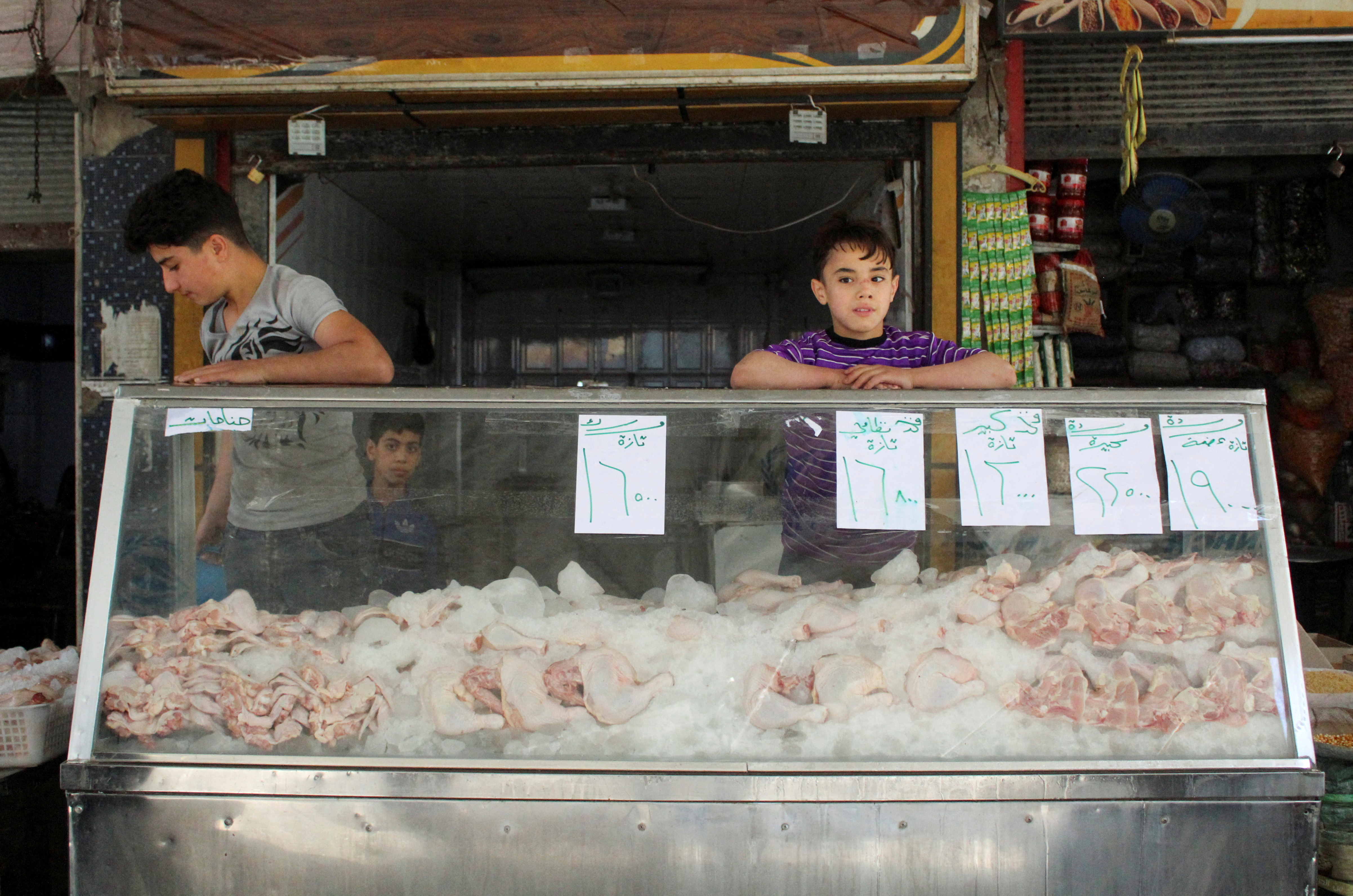 FILE PHOTO: Poultry is displayed for sale at a market in Douma