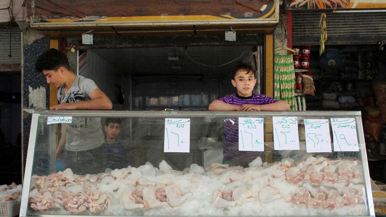 FILE PHOTO: Poultry is displayed for sale at a market in Douma