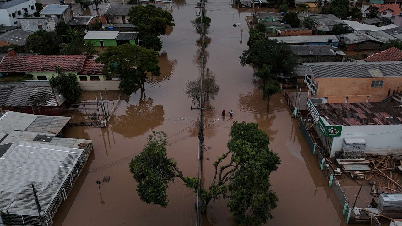 The Wider Image: Flood-battered farmers in southern Brazil wade through lost harvests