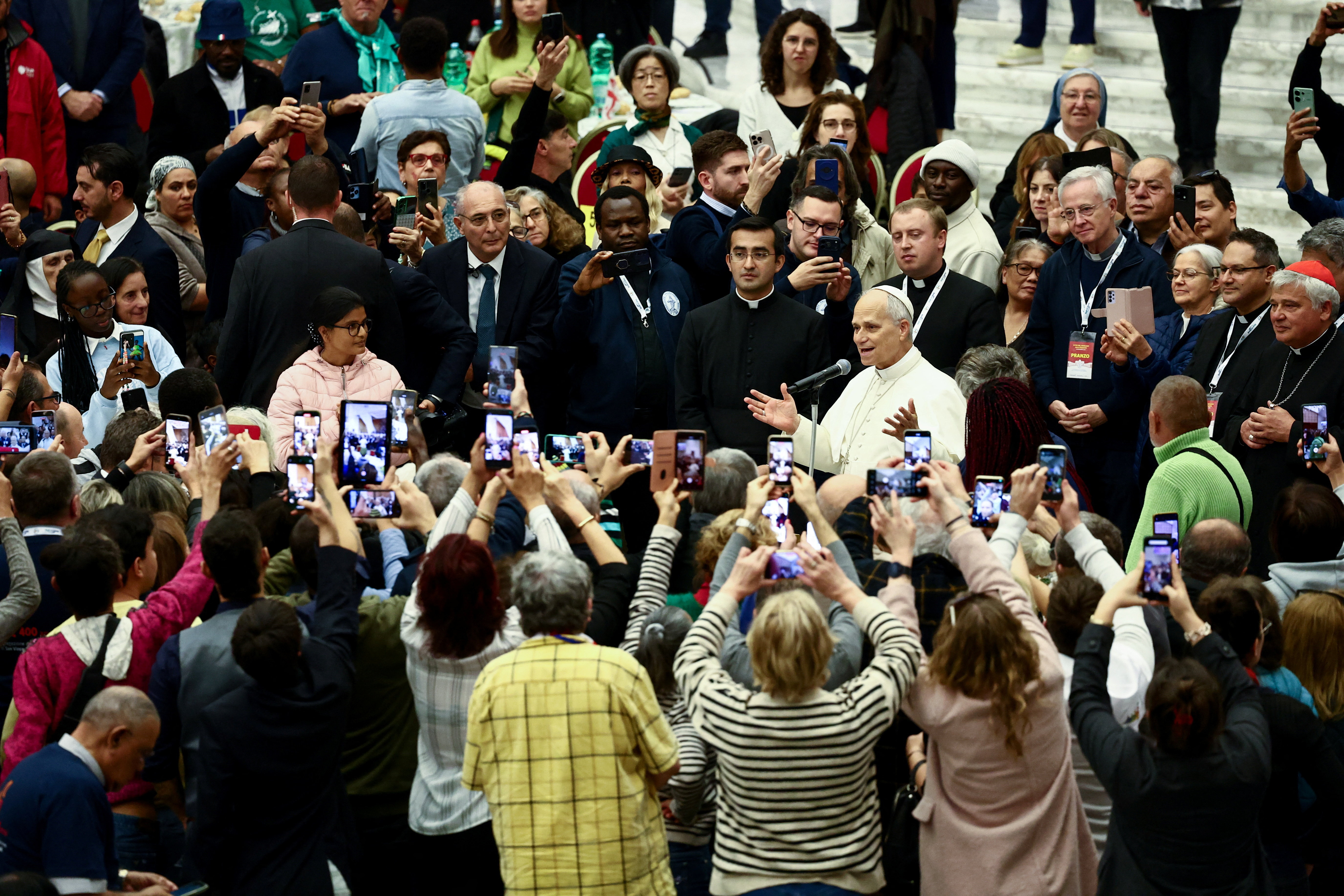 Pope Leo XIV attends a lunch with poor people in Paul VI Hall at the Vatican
