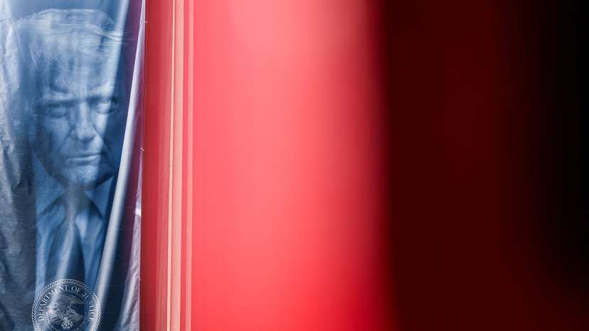 A banner depicting U.S. President Donald Trump hangs outside the Department of Justice building in Washington