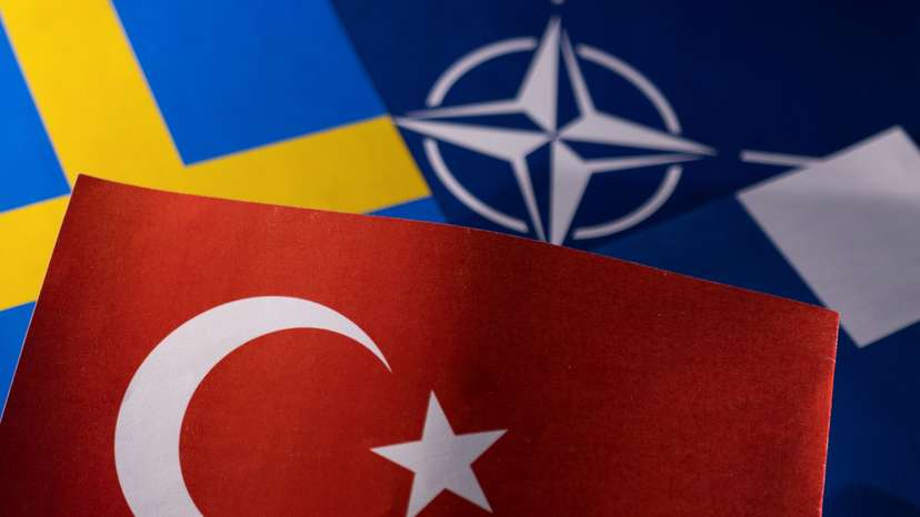 Illustration shows NATO, Turkish, Swedish and Finnish flags