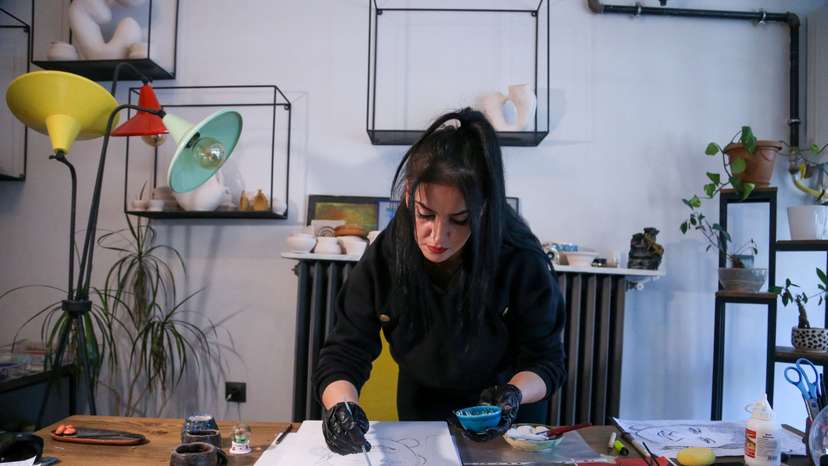 Turkish artist paints portrait of woman using ashes from her cremation, in Urgup