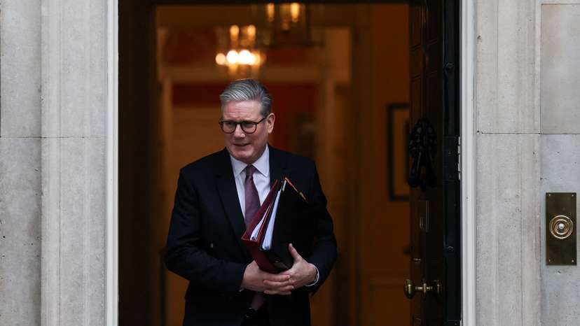 British Prime Minister Keir Starmer walks in front of 10 Downing Street in London