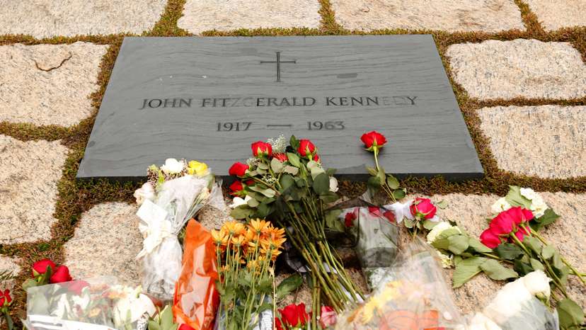 FILE PHOTO: Flowers adorn Kennedy's grave in Arlington on the 50th anniversary of his assassination