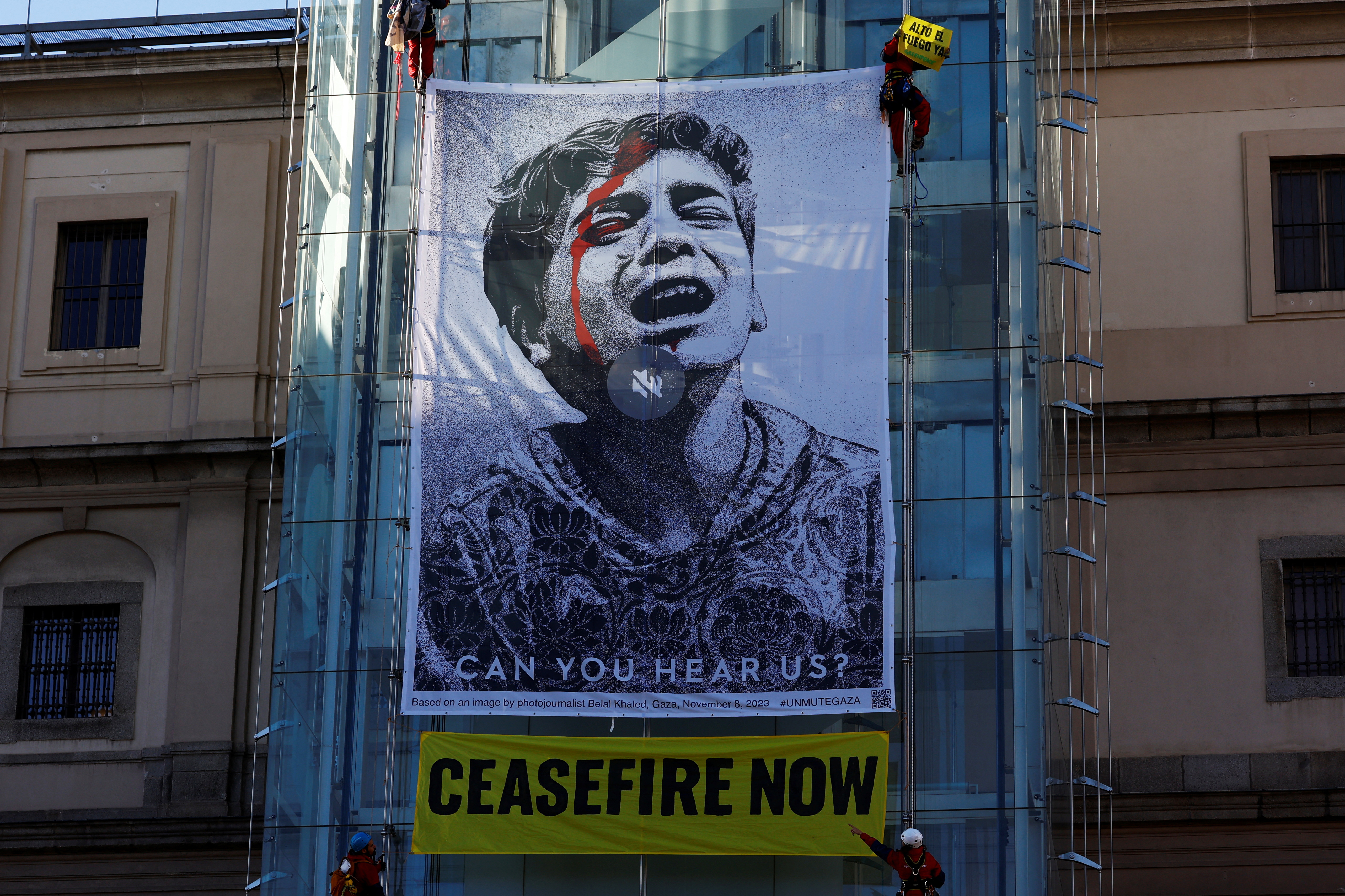 Greenpeace activists display illustration on Reina Sofia Museum in Madrid