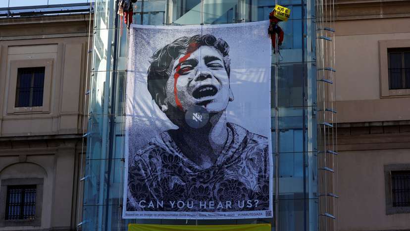 Greenpeace activists display illustration on Reina Sofia Museum in Madrid