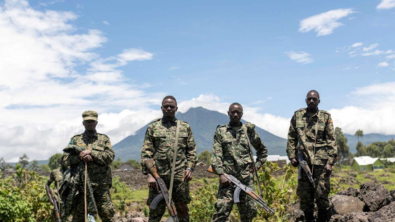 FILE PHOTO: Members of the Ugandan army, part of the troops to the EACRF, stand at a settlement ceded by M23 rebels fighters in Bunagana