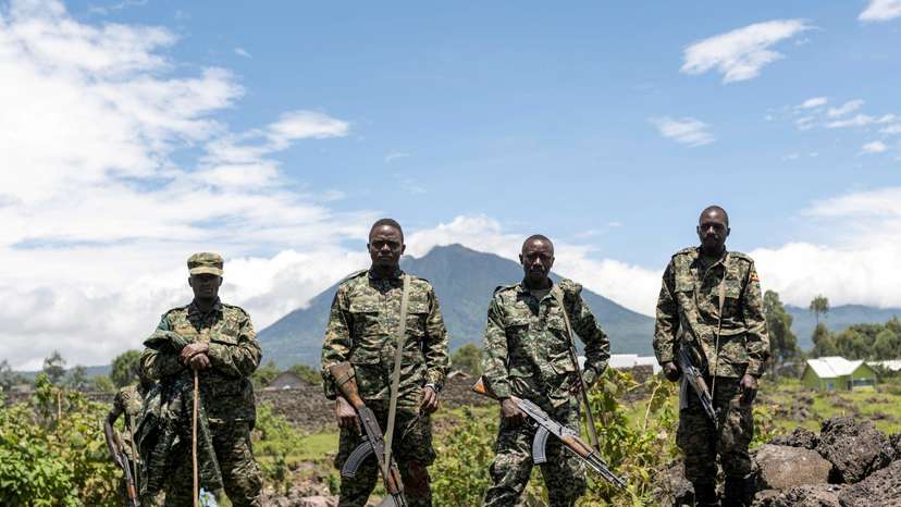FILE PHOTO: Members of the Ugandan army, part of the troops to the EACRF, stand at a settlement ceded by M23 rebels fighters in Bunagana