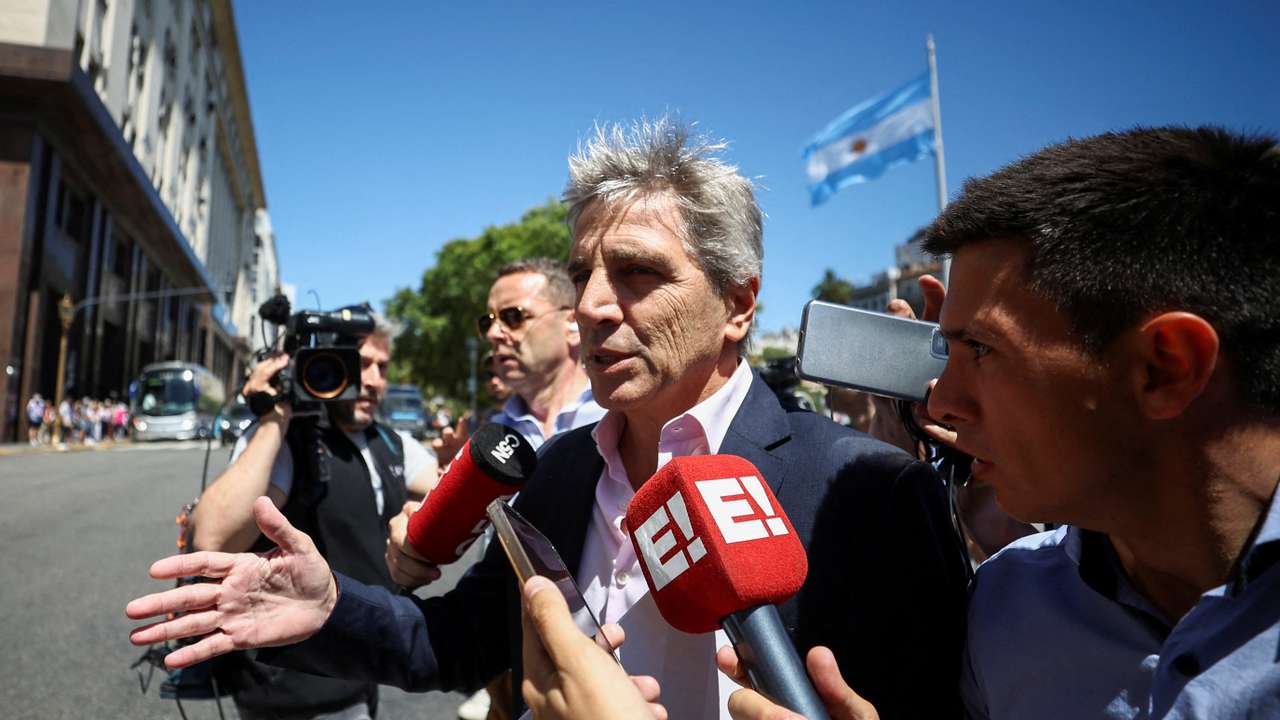 FILE PHOTO: Argentina's Minister of Economy Caputo walks, in Buenos Aires