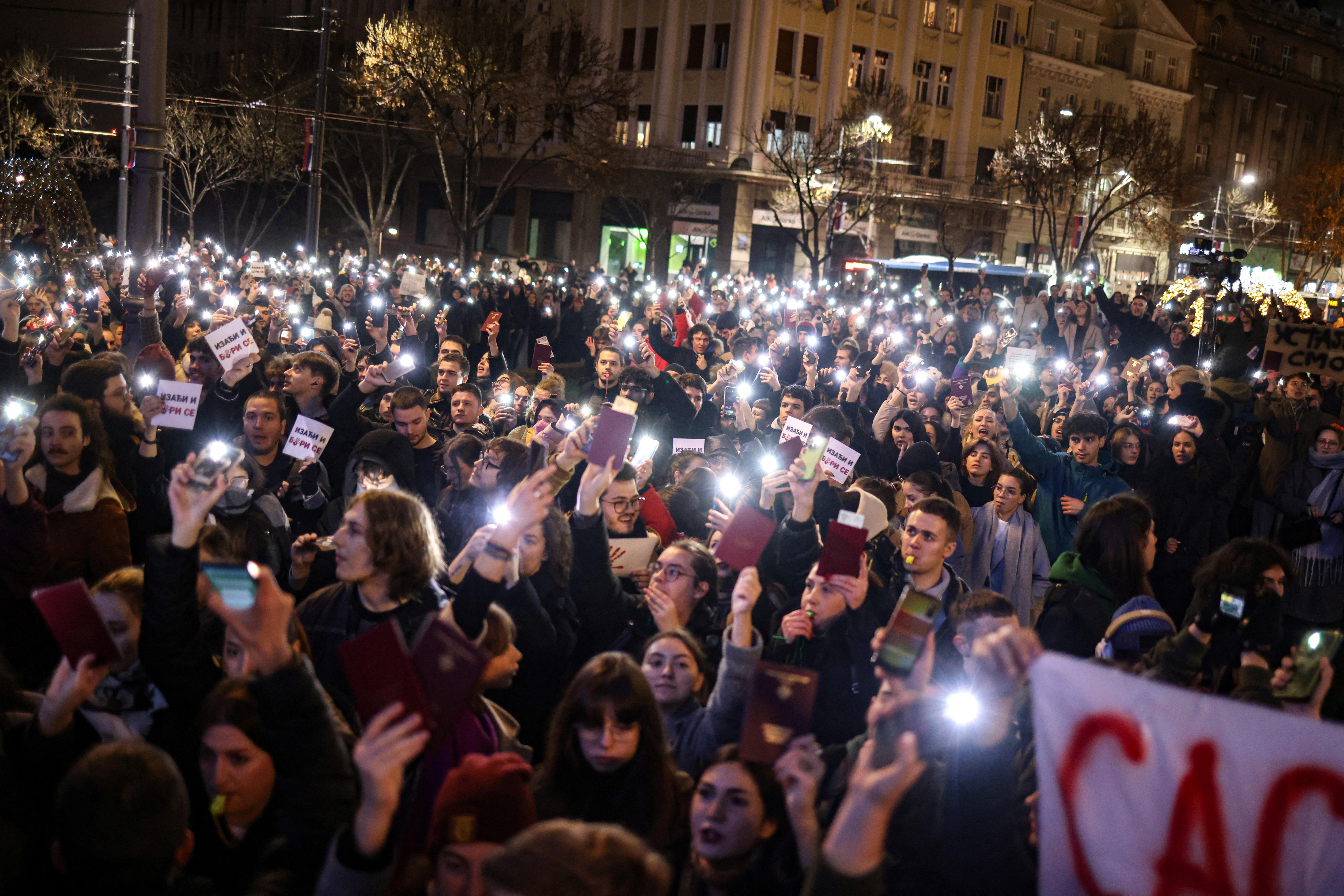 Students of Belgrade University protest, as Serbian President Aleksandar Vucic holds a news conference, in front of his office in Belgrade