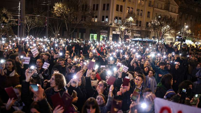 Students of Belgrade University protest, as Serbian President Aleksandar Vucic holds a news conference, in front of his office in Belgrade