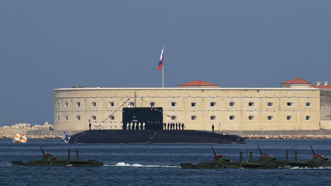 FILE PHOTO: Russian sailors line up on board the diesel-electric submarine "Novorossiysk" during the Navy Day parade in Sevastopol