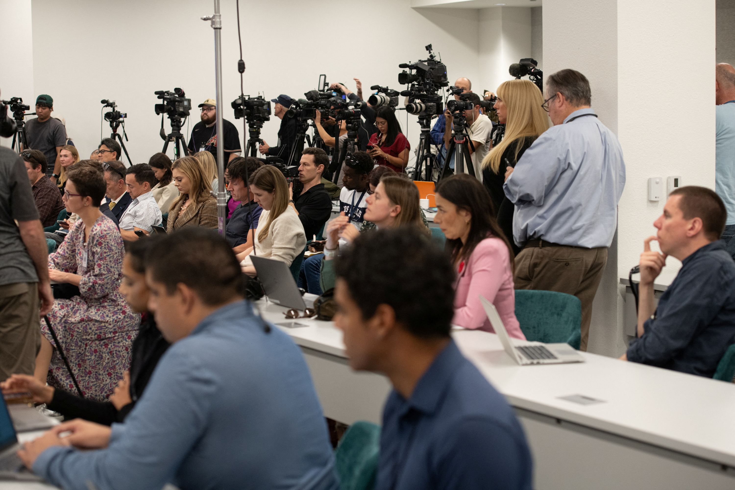 Members of the media listen to Maricopa County Election officials ahead of the presidential election in Phoenix