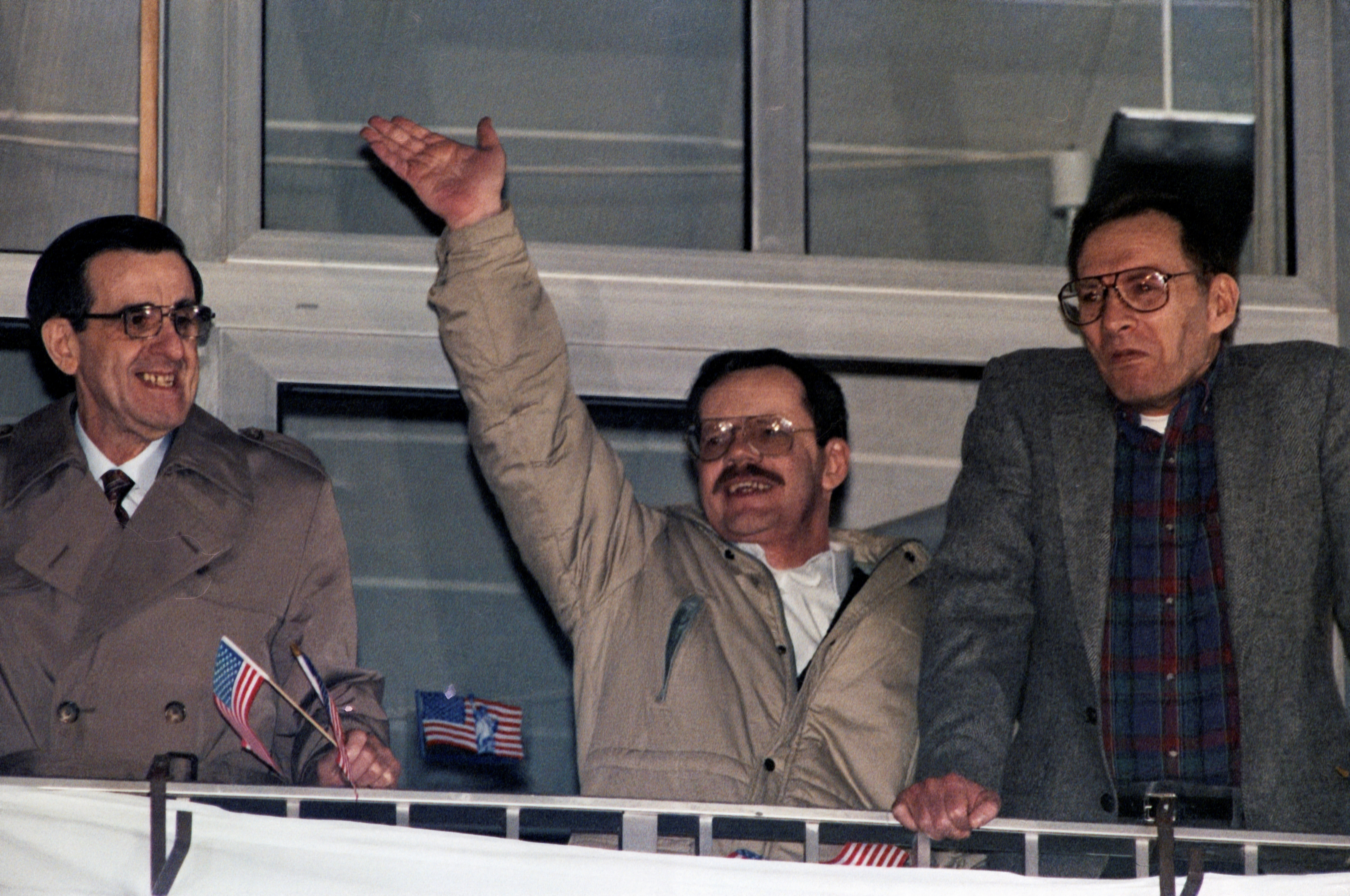 Hostages from the U.S. Joseph Cicippio,Terry Anderson and Alann Steen pose on the balcony of the U.S. military hospital in Wiesbaden
