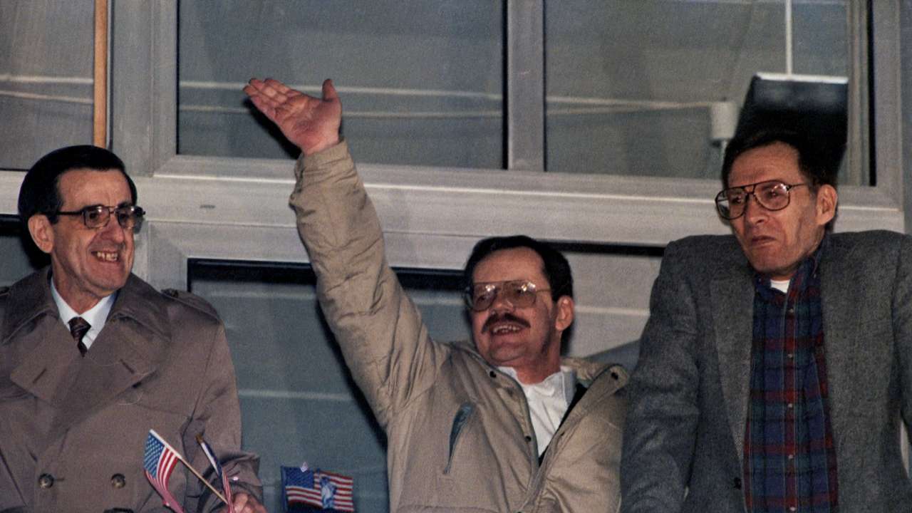 Hostages from the U.S. Joseph Cicippio,Terry Anderson and Alann Steen pose on the balcony of the U.S. military hospital in Wiesbaden