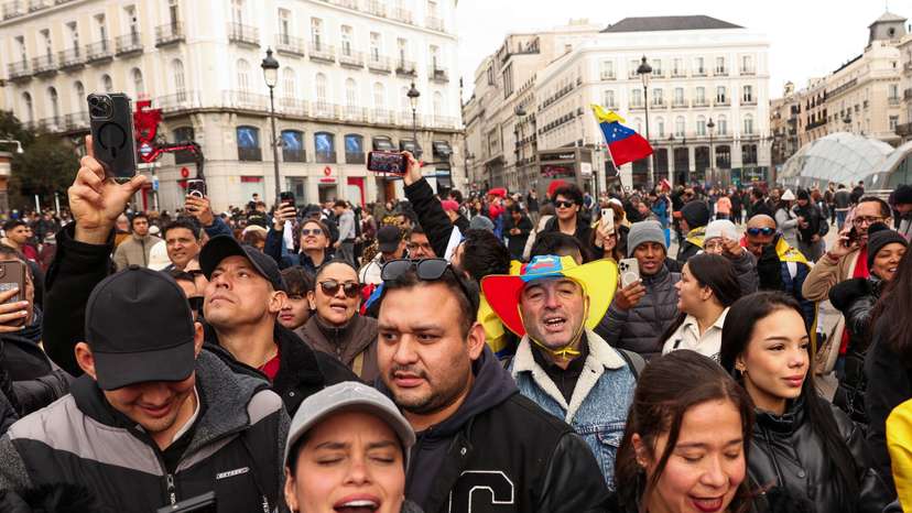 People react to the news of U.S. strikes on Venezuela and capture of President Maduro, in Madrid