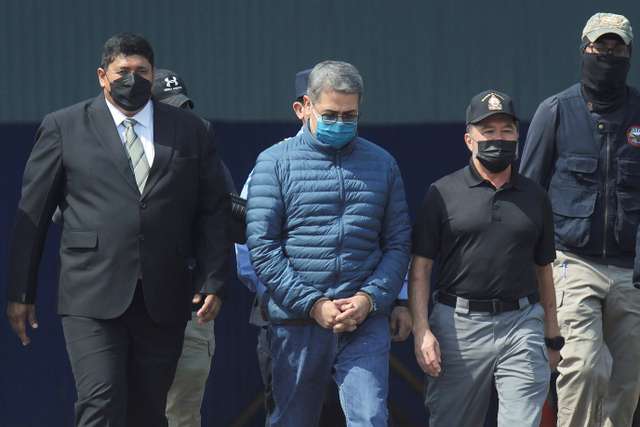 Honduras former President Juan Orlando Hernandez is being transported to the U.S., in Tegucigalpa