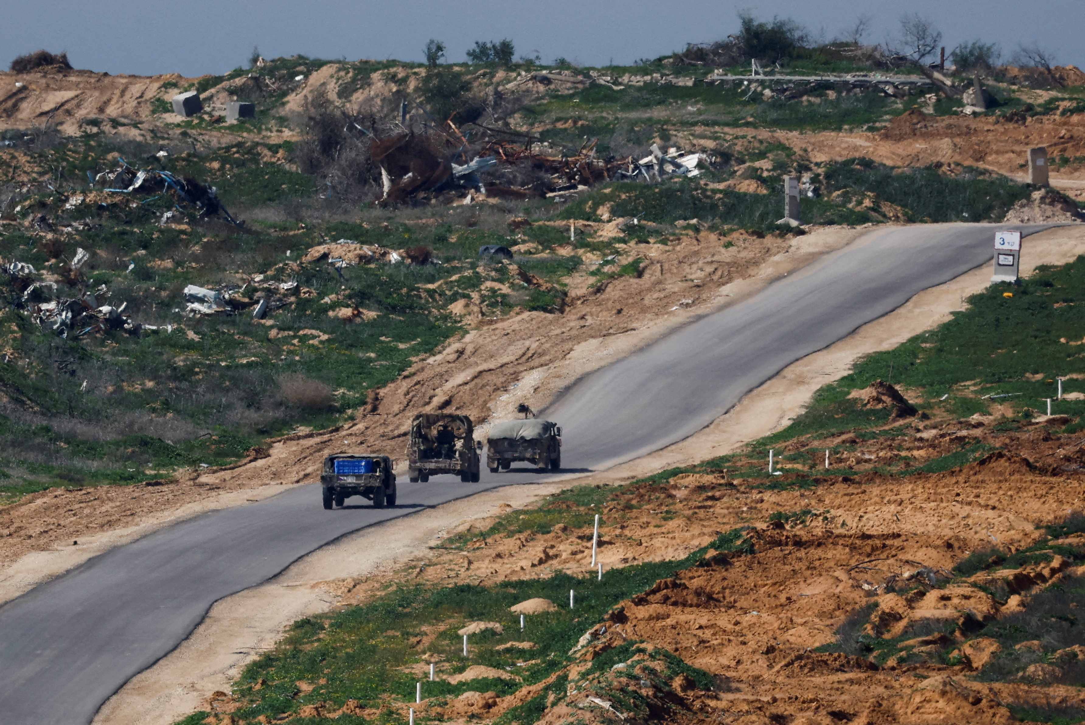 FILE PHOTO: Israeli military jeeps manoeuvre in Gaza