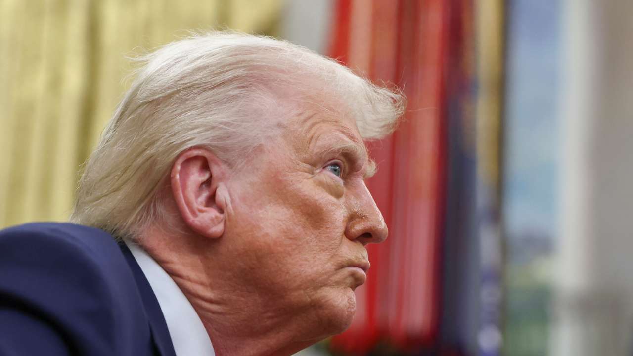 U.S. President Donald Trump signs executive orders in the Oval Office, at the White House in Washington, D.C.