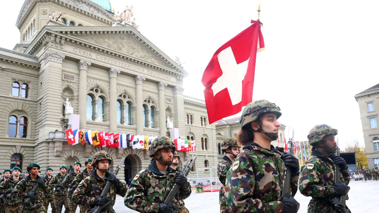 FILE PHOTO: Soldiers from the Swiss army's Infantry Readiness Company 104/1 and the Guard of Honour march past the Swiss Parliament building in Bern