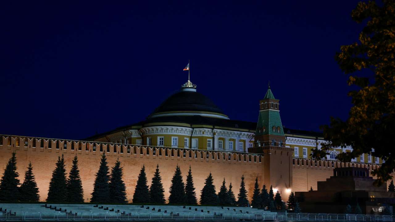The Russian flag flies on the dome of the Kremlin Senate building in Moscow