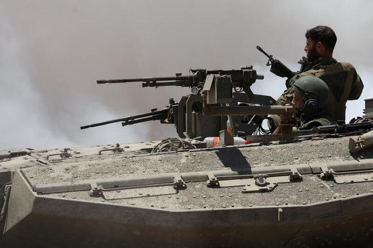 An Israeli tank manoeuvres near the Israel-Gaza border