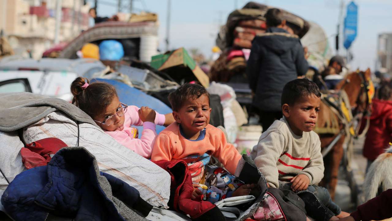 Displaced Palestinians wait to be allowed to return to their homes in northern Gaza, in the central Gaza Strip