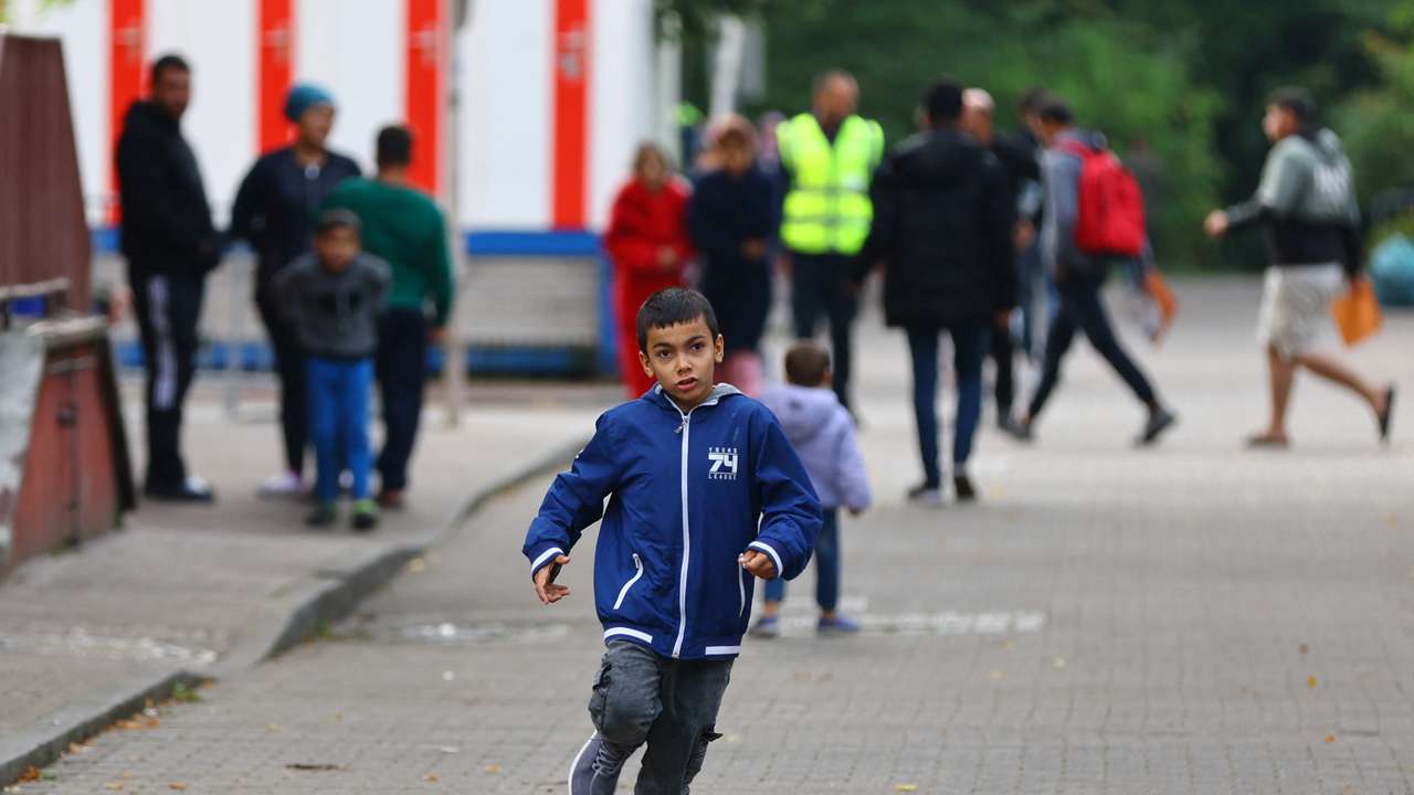 Migrants pictured at the arrival center for asylum seekers at Berlin's Reinickendorf district