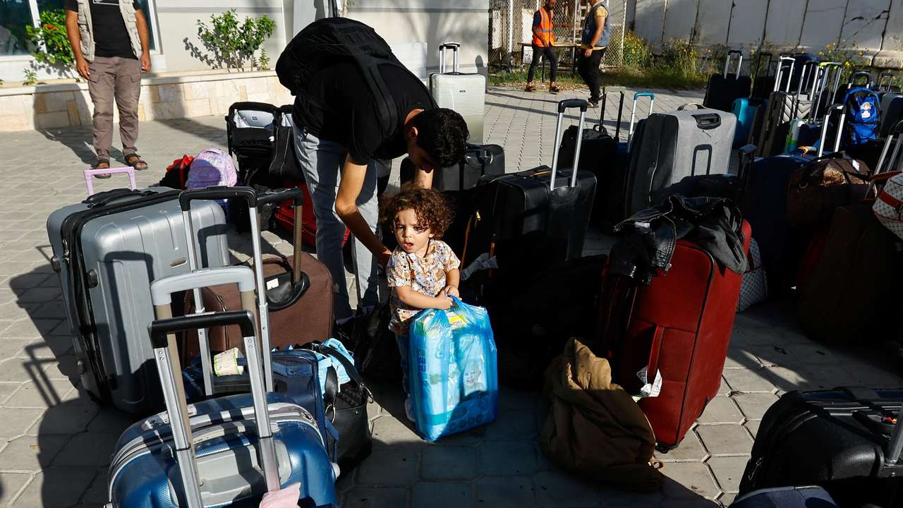 Palestinians with foreign passports wait for permission to leave Gaza